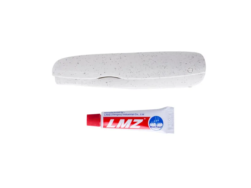 Cepillo de dientes plegable Amondo con tubo de pasta en natural, vista frontal